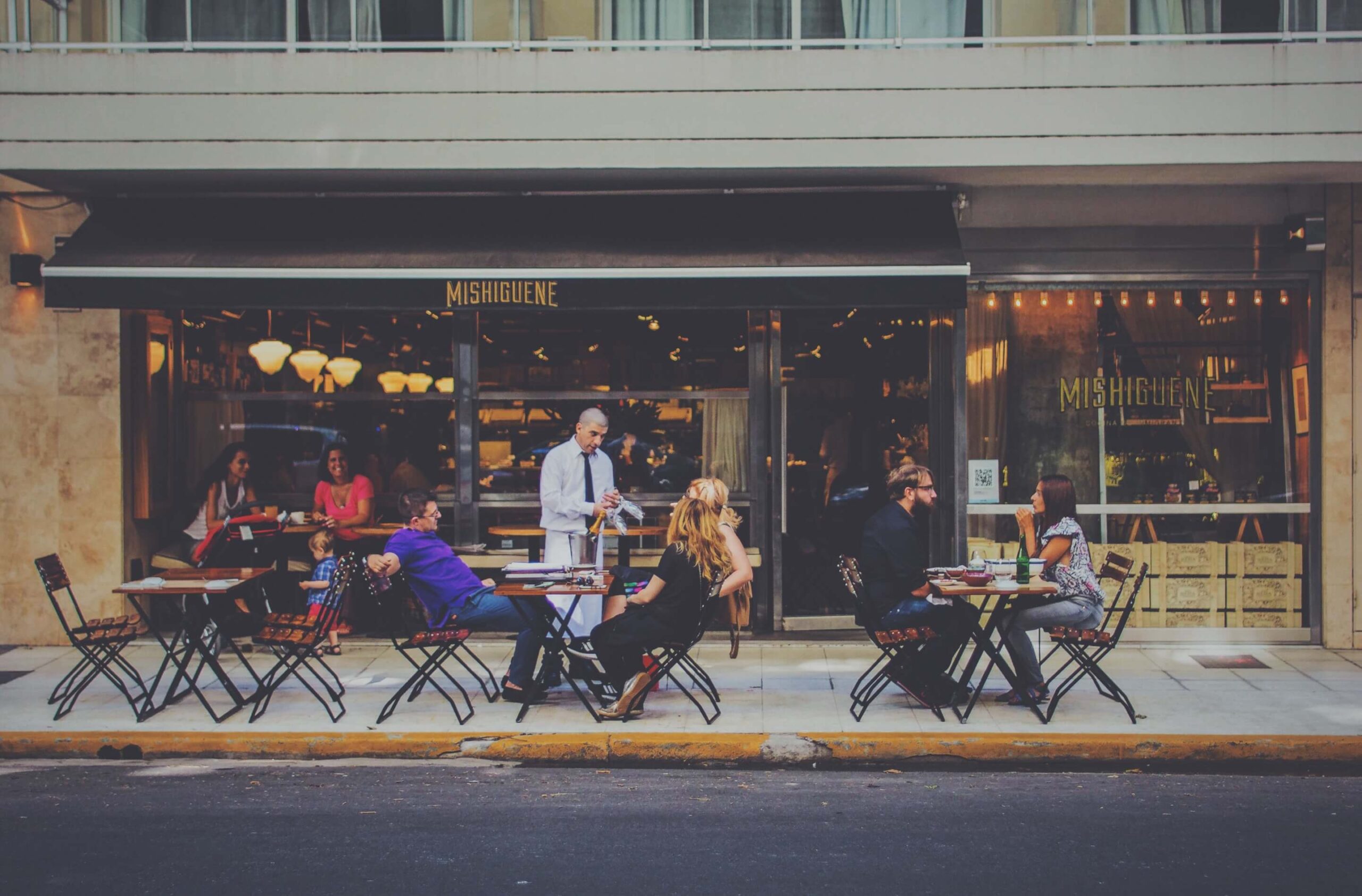 People at Coffee Shop sitting Outside
